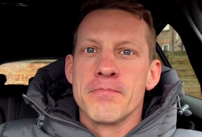 James Sutton taking a selfie in his car