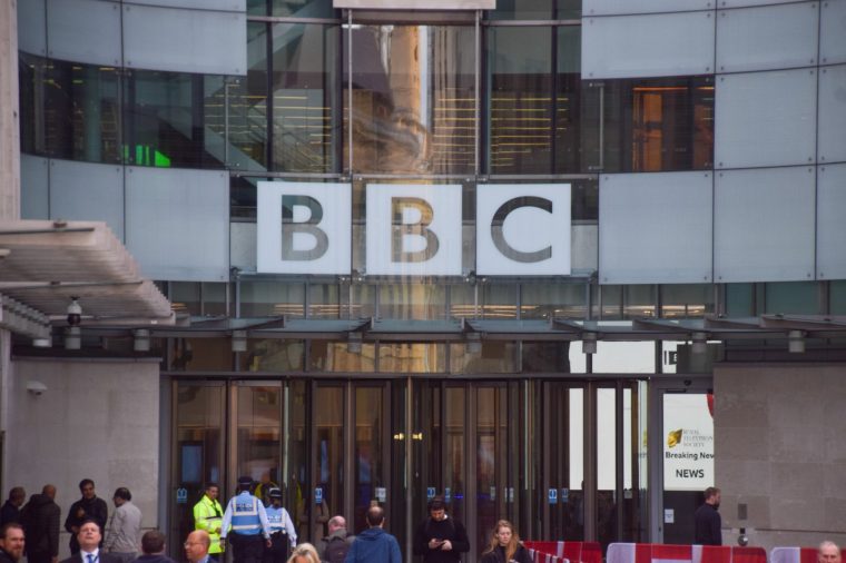 London, UK - April 15 2025. General view of Broadcasting House, the BBC headquarters in central London, with people walking outside.