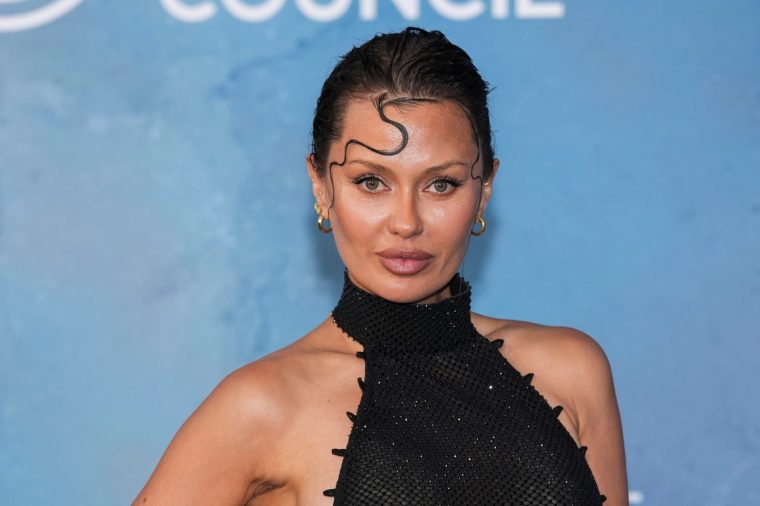 FILE - Victoria Bonya poses for photographers upon arrival at the amfAR gala at the Arsenale di Venezia, in Venice, Italy, on Sunday, Aug. 31, 2025. (Photo by Scott A Garfitt/Invision/AP, File)