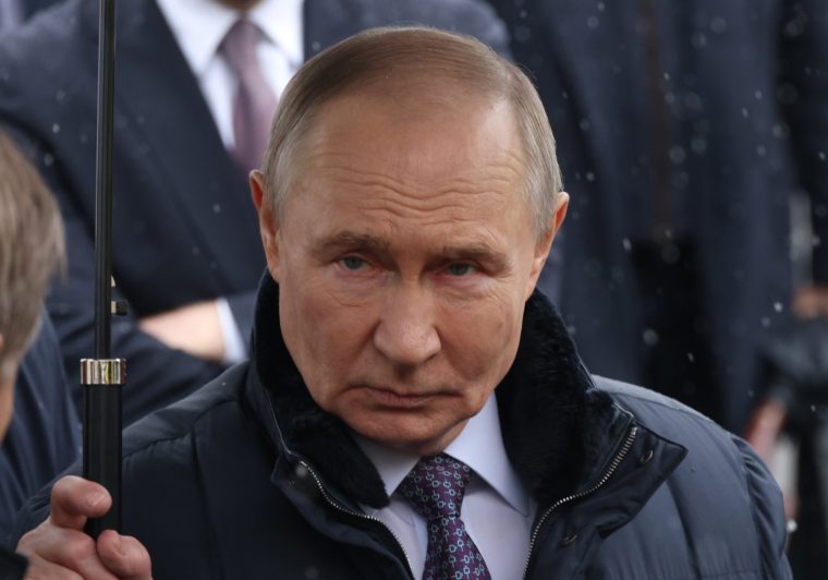 MOSCOW, RUSSIA - APRIL 28: Russian President Vladimir Putin holds an umbrella while visiting the Federal Center For Disaster Medicine, on April 28, 2026 in Moscow, Russia. On the Day of the Emergency Medical Worker, Putin visited the Federal Disaster Medicine Center of the National Medical and Surgical Center named after N.I.Pirogov and took part in the opening ceremony of new emergency departments in the regions via video link. (Photo by Contributor/Getty Images)