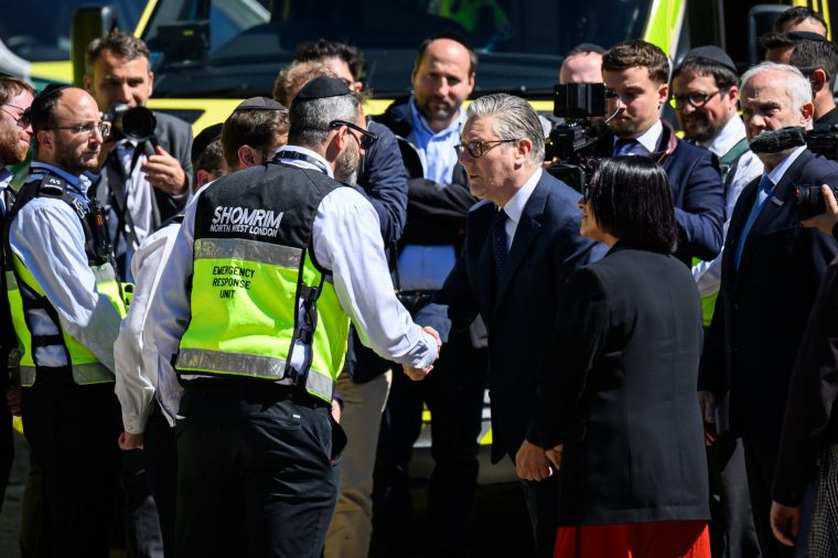 LONDON, ENGLAND - APRIL 30: Prime Minister Keir Starmer (C) and Home Secretary Shabana Mahmood (CR) meet members of Shomrim, the Jewish community security organisation, in Golders Green following yesterday's attack on April 30, 2026 in Golders Green, England. A 45-year-old British-Somali man was arrested yesterday, after stabbing two Jewish men, Shloime Rand and Moshe Shine, in a terrorist attack in Golders Green. Both victims are in a stable condition, and the suspect was caught by police after being tasered. The government has since pledged ??25 million to improve security for the Jewish community following the incident. (Photo by Leon Neal/Getty Images)