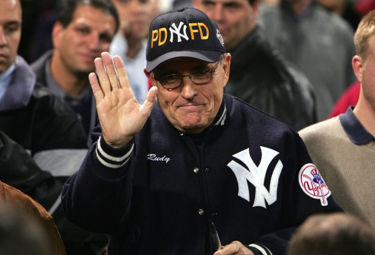 FILE - MAY 03: Rudy Giuliani, the former mayor of New York City, is in critical, but stable condition, in a Florida hospital according to his spokesperson on May 03, 2026. Giuliani is 81 years old. BOSTON - OCTOBER 17: Former New York City mayor Rudy Giuliani and Yankees fan waves during game four of the American League Championship Series against the Boston Red Sox on October 17, 2004 at Fenway Park in Boston, Massachusetts. (Photo by Jed Jacobsohn/Getty Images)