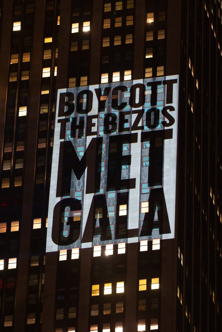 Activists project protest messages highlighting issues of wealth inequality, climate accountability, and labor rights, onto the Empire State Building on the eve of the Met Gala, the star-studded fundraiser known for its extravagant fashion and high profile guests, in New York City, U.S., May 3, 2026. REUTERS/David 'Dee' Delgado