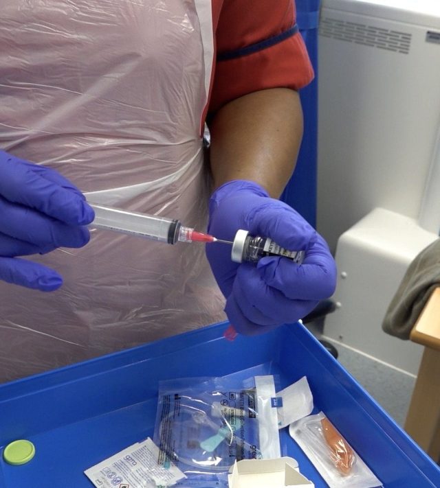 Screen grab taken from PA Video dated 27/04/26 of a nurse preparing a new one-minute injection for more than a dozen cancers, at the Mount Vernon Cancer Centre in Hertfordshire. The immunotherapy injection, being rolled out on the NHS, works by telling the body's immune system to recognise and kill cancer cells and is powerful against several types of the disease, including lung, breast, head and neck, and cervical cancer. Issue date: Monday May 4, 2026. PA Photo. Until now, patients have had to spend long periods on a drip to get the drug pembrolizumab (Keytruda) into their system. Photo credit should read: Shivansh Gupta/PA Wire NOTE TO EDITORS: This handout photo may only be used in for editorial reporting purposes for the contemporaneous illustration of events, things or the people in the image or facts mentioned in the caption. Reuse of the picture may require further permission from the copyright holder.