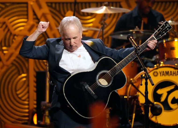 HOLLYWOOD, CALIFORNIA - APRIL 06: In this image released on December 21, Paul Simon performs onstage during Homeward Bound: A GRAMMY Salute To The Songs Of Paul Simon at Hollywood Pantages Theatre on April 06, 2022 in Hollywood, California. (Photo by Kevin Mazur/Getty Images for The Recording Academy)