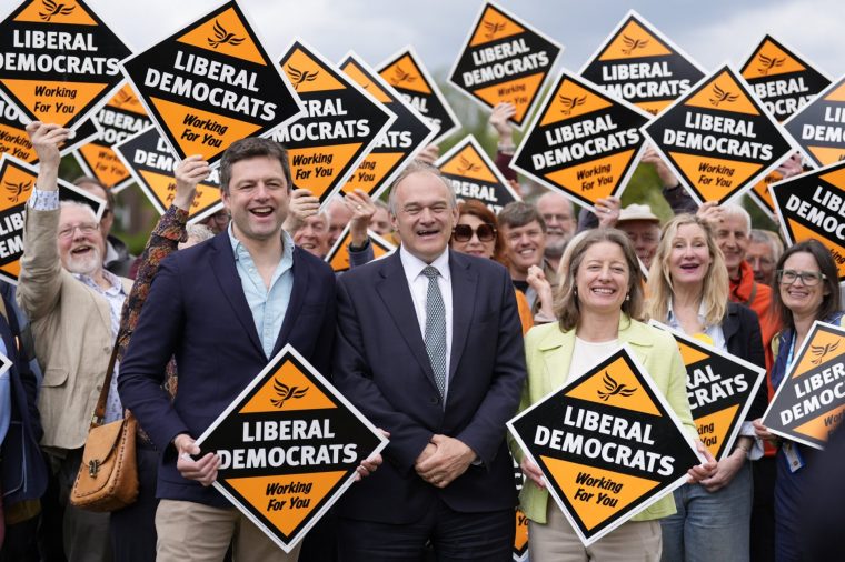 Liberal Democrat leader Sir Ed Davey (centre), MP for Epsom and Ewell, Helen Maguire, and MP for Dorking and Horley, Chris Coghlan, surrounded by supporters during a party rally at Redhill Memorial Park in Surrey, on the last day of campaigning ahead of the local elections on Thursday. Picture date: Wednesday May 6, 2026. PA Photo. Photo credit should read: Andrew Matthews/PA Wire