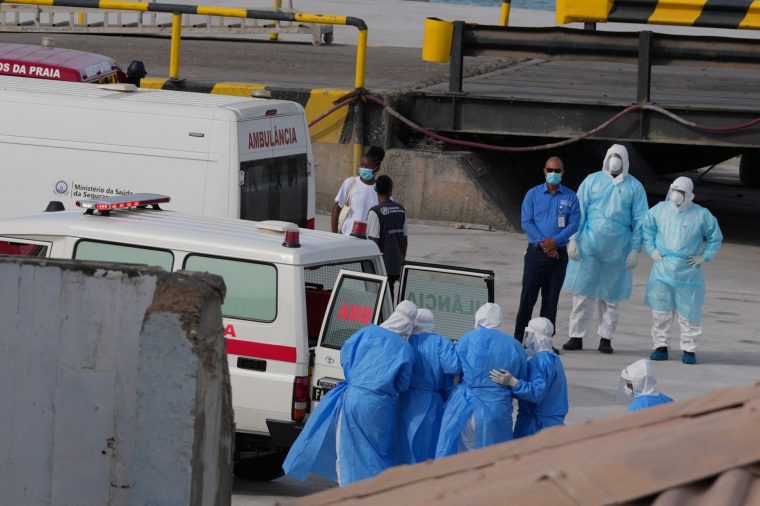 Health workers in protective gear evacuate patients from the MV Hondius cruise ship into an ambulance at a port in Praia, Cape Verde, Wednesday, May 6, 2026. (AP Photo/Misper Apawu)