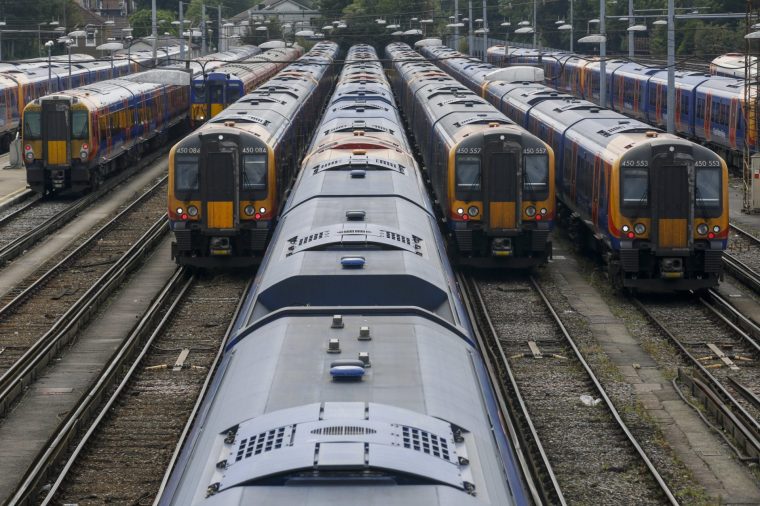 A group of commuter trains sit in a railway siding in London, U.K. Photographer: Luke MacGregor/Bloomberg