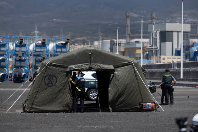 epaselect epa12941579 Civil Guard officers and local policemen prepare the command post set up at the port of Granadilla de Abona, in Tenerife Island, during preparations for the arrival of the cruise ship MV Hondius, affected by hantavirus outbreak, Canary Islands, southwestern Spain, 08 May 2026. According to the World Health Organization (WHO), eight cases of hantavirus have been reported, including three deaths, on the cruise ship that is expected to dock in the Canary Islands at the weekend. EPA/MIGUEL BARRETO