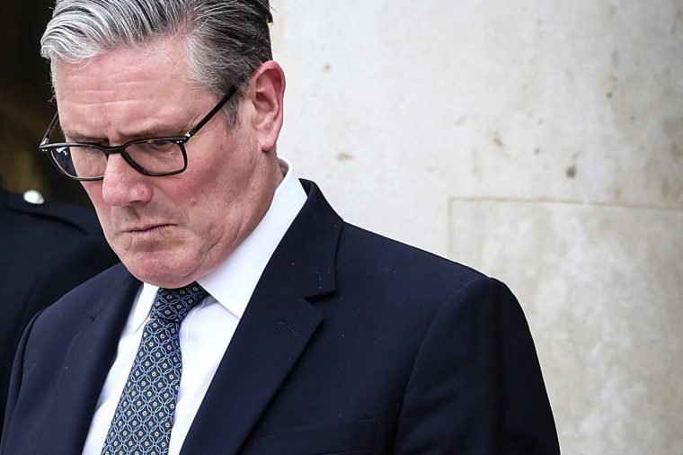 (FILES) Britain's Prime Minister Keir Starmer reacts as he prepares to leave the Elysee Presidential Palace in Paris on April 17, 2026. British Prime Minister Keir Starmer promised on May 9, 2026, he would "listen to voters" after his Labour party received a historic drubbing in local and regional elections. (Photo by Tom Nicholson / POOL / AFP via Getty Images)