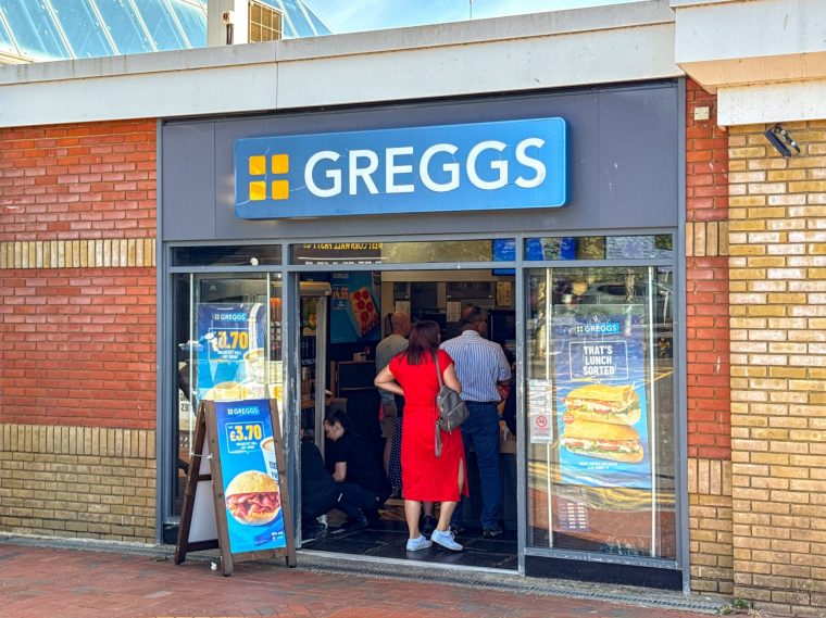 Reading, Berkshire, England, UK - 4 July 2025: People queuing at the branch of Greggs in the M4 motorway services at Reading.