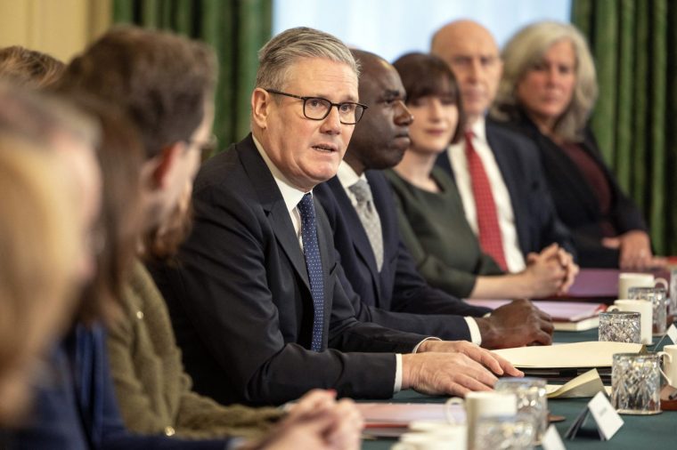 Britain's Prime Minister Keir Starmer (C) speaks to members of his political Cabinet at the start of the first cabinet meeting of the new year inside 10 Downing Street in central London on January 6, 2026. (Photo by Richard Pohle / POOL / AFP via Getty Images)