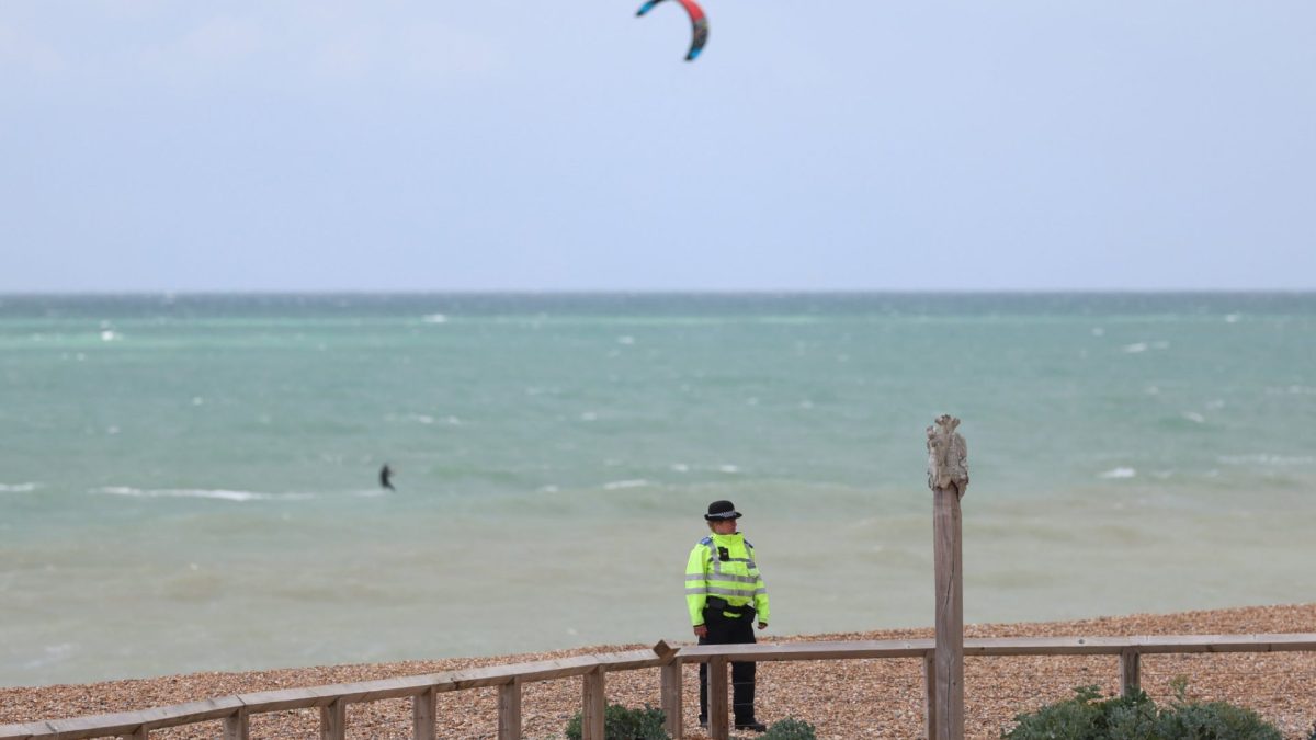 BRIGHTON, ENGLAND - MAY 13: Police guard the beach after the bodies of three women were recovered from the sea in Brighton on May 13, 2026 in Brighton, England. Police say the bodies of three women have been recovered from the sea in Brighton, after emergency services received calls for concern over their welfare around 5:45 this morning. Police are working to identify the women and investigate the circumstances of their deaths. (Photo by Bryn Lennon/Getty Images)