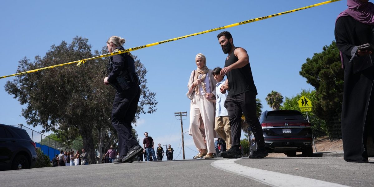 Police tape is placed near the scene of a shooting outside the Islamic Center of San Diego Monday, May 18, 2026, in San Diego. (AP Photo/Gregory Bull)
