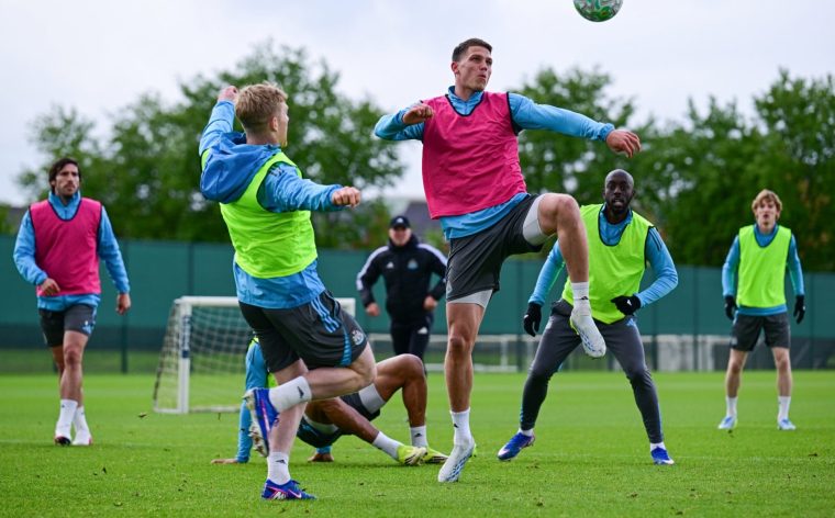 NEWCASTLE UPON TYNE, ENGLAND - MAY 13: Sven Botman (R) volley's the ball away from a challenging Lewis Hall (L) in a possession drill also seen from L-R Sandro Tonali, Eddie Howe, Yoane Wissa and Anthony Gordon during the Newcastle United Training Session at the Newcastle United Training Centre on May 13, 2026 in Newcastle upon Tyne, England. (Photo by Serena Taylor/Newcastle United via Getty Images)