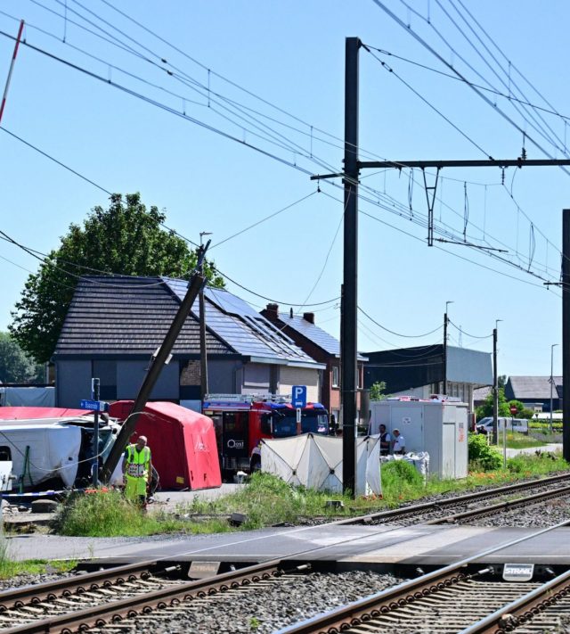 This photograph shows the site of an accident after a train crashed into a school bus, at the railway crossing Vierhuizen in Buggenhout on May 26, 2026. (Photo by DIRK WAEM / BELGA / AFP via Getty Images) / Belgium OUT
