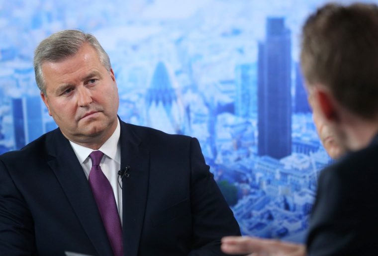 Albert Manifold, chief executive officer of CRH Plc, left, pauses during a Bloomberg Television interview in London, U.K., on Tuesday, Aug. 19, 2014. CRH, the biggest company on the benchmark Irish stock index, said it may spend as much as 1.5 billion euros ($2 billion) on acquisitions over the next 18 months, after the building-materials supplier reported a 27 percent increase in first-half earnings. Photographer: Chris Ratcliffe/Bloomberg via Getty Images