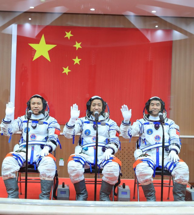 JIUQUAN, CHINA - JUNE 17: (L-R) Astronauts Tang Hongbo, Nie Haisheng and Liu Boming attend a see-off ceremony for Chinese astronauts of the Shenzhou-12 manned space mission at Jiuquan Satellite Launch Center on June 17, 2021 in Jiuquan, Gansu Province of China. China launches the Shenzhou-12 spacecraft, carried on the Long March-2F rocket, to Chinese Tiangong space station. (Photo by Yang Zhiyuan/VCG via Getty Images)