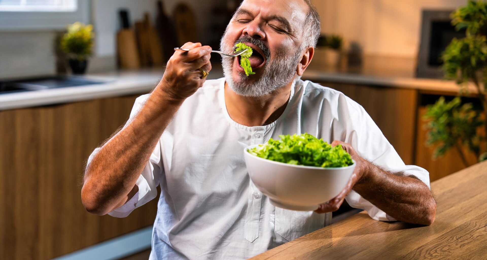 Senior Indian Man Eating Green Salad