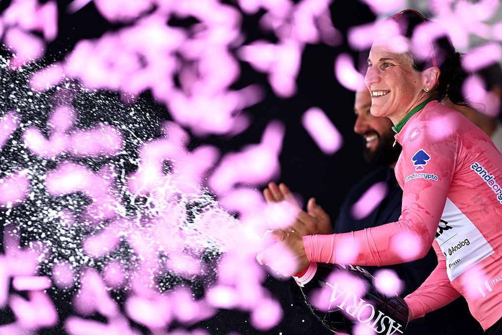 MONTE NERONE, ITALY - JULY 12: Elisa Longo Borghini of Italy and UAE Team ADQ celebrates at podium as Pink Leader Jersey winner during the 36th Giro d'Italia Women 2025, Stage 7 a 150km stage from Fermignano to Monte Nerone 1396m / #UCIWWT / on July 12, 2025 in Monte Nerone, Italy. (Photo by Luc Claessen/Getty Images)