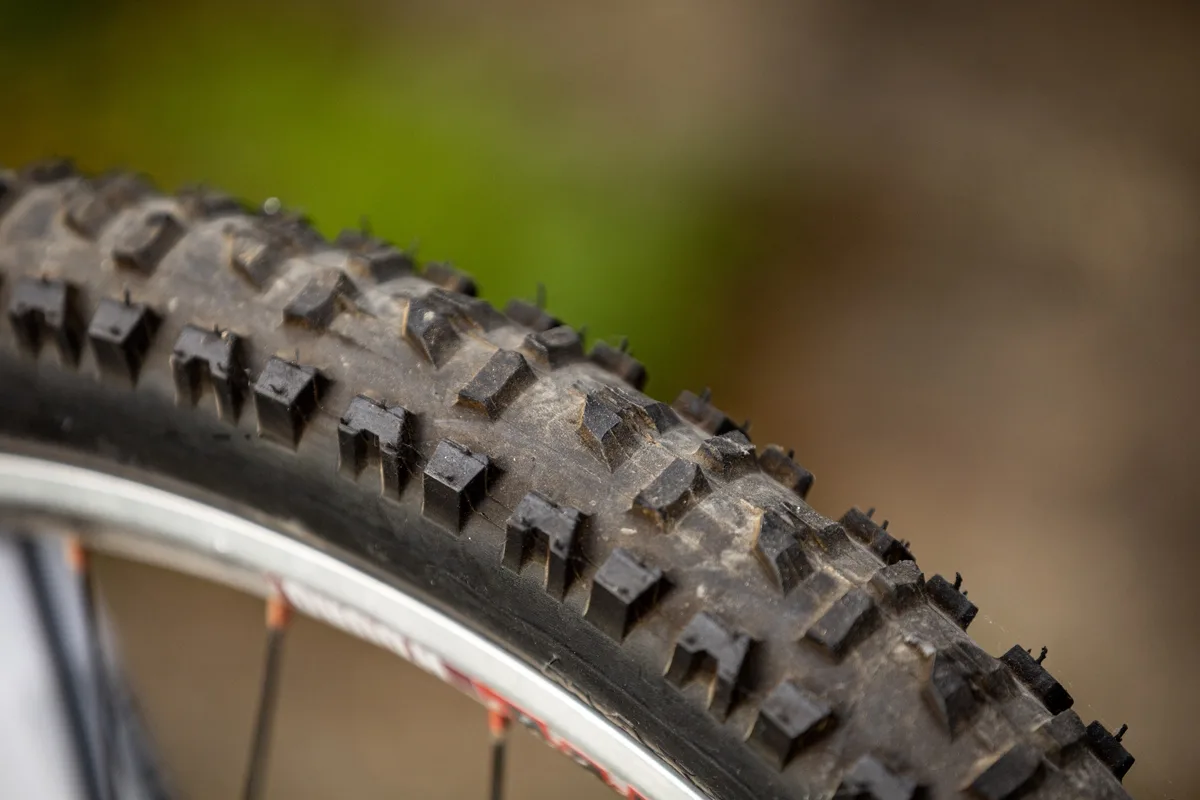 Close-up of the hand-cut front tyre on Steve Peat’s 2009 Santa Cruz V10 downhill bike.