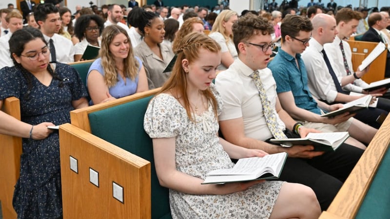 A congregation sings during a devotional given by Elder Quentin L. Cook and Elder Clark G. Gilbert of the Quorum of the Twelve Apostles, which was heard across the UK and Ireland via a historic broadcast originating from the Hyde Park Chapel in London on Sunday, May 24, 2026.