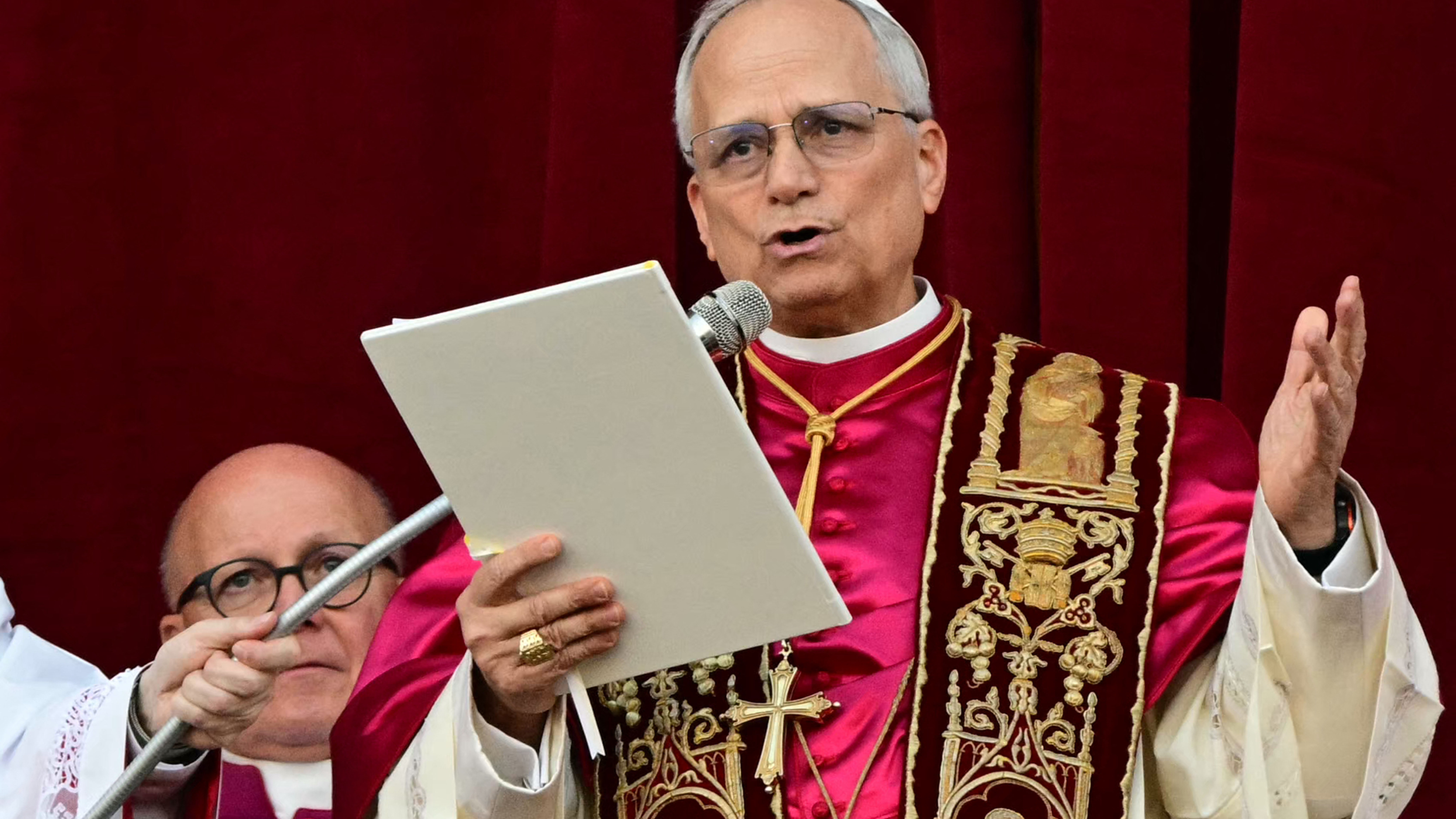 Newly elected Pope Leo XIV, Robert Prevost addresses the crowd on the main central loggia balcony of the St Peter's Basilica.