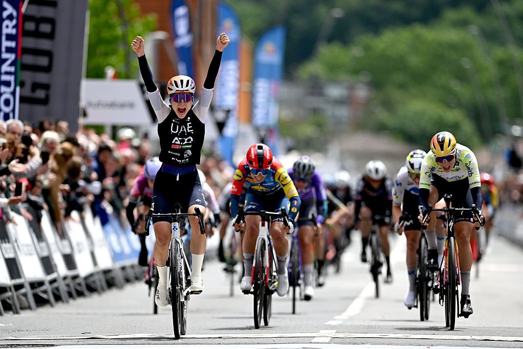 AMOREBIETA-ETXANO, SPAIN - MAY 16: (L-R) Dominika Wlodarczyk of Poland and UAE Team ADQ celebrates at finish line as stage winner ahead of Shirin van Anrooij of Netherlands and Team Lidl - Trek and Mischa Bredewold of Netherlands and Team SD Worx - Protime - Yellow Leader Jersey during the 5th Itzulia Women 2026, Stage 2 a 138km stage from Abadino to Amorebieta-Etxano / #UCIWWT / on May 16, 2026 in Amorebieta-Etxano, Spain. (Photo by Szymon Gruchalski/Getty Images)