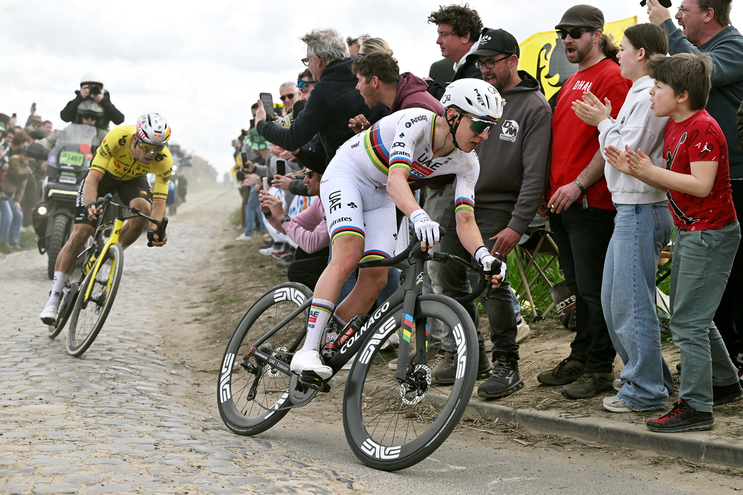 ROUBAIX, FRANCE - APRIL 12: (L-R) Wout van Aert of Belgium and Team Visma | Lease a Bike and Tadej Pogacar of Slovenia and UAE Team Emirates - XRG compete in the breakaway while fans cheer during the 123rd Paris-Roubaix Hauts-de-France 2026 - Men's Elite a 258.3km one day race from Compiegne to Roubaix / #UCIWT / on April 12, 2026 in Roubaix, France. (Photo by Dario Belingheri/Getty Images)