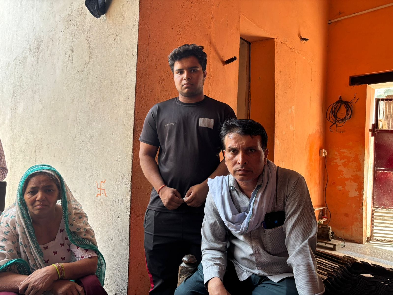 Pawan's father (right) and brother (centre). His family says they had no clue about his online betting addiction | Samridhi Tewari | ThePrint 