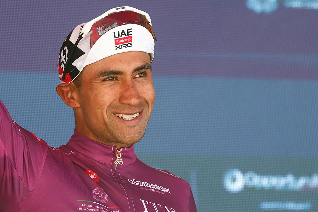 UAE Team Emirates - XRG Ecuadorian rider Jhonatan Narvaez poses with the best sprinter's cyclamen jersey on the podium of the 14th stage of the Giro d'Italia 2026 - Tour of Italy cycling race between Aosta and Pila (Gressan), Italy, on May 23, 2026. (Photo by Luca Bettini / AFP)