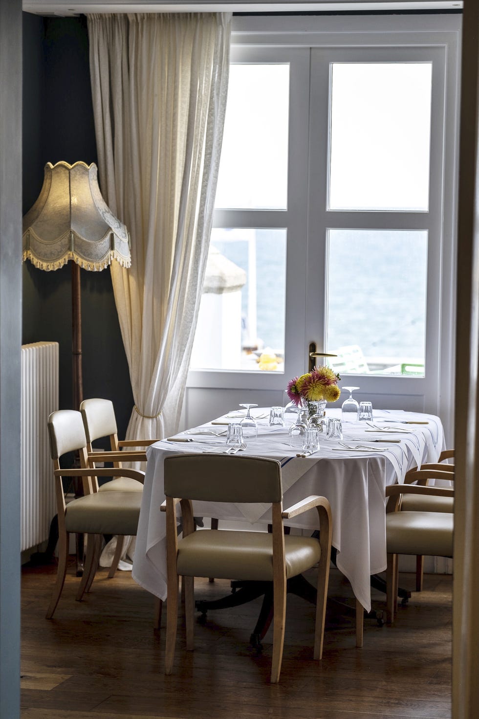 a dining area with a table set for a meal a dining area with a table set for a meal