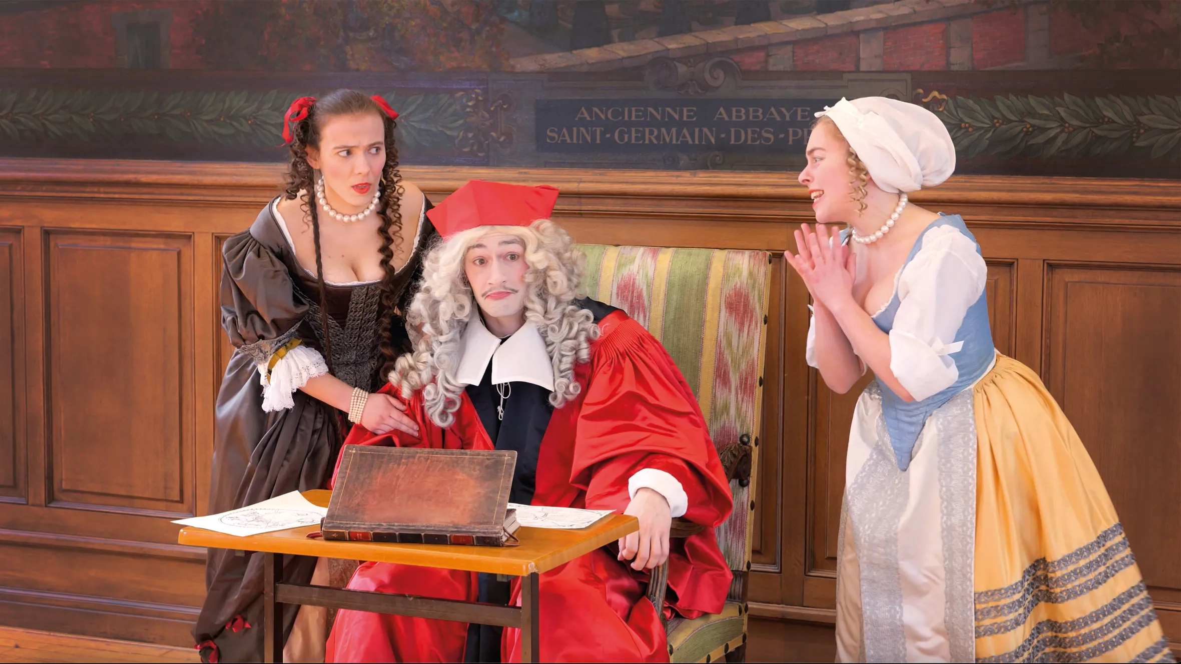 Actors in period costumes performing The Astrologer or False Omens.