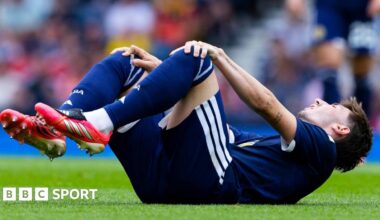 Scotland midfielder Billy Gilmour is comforted by team-mates after picked up an injury