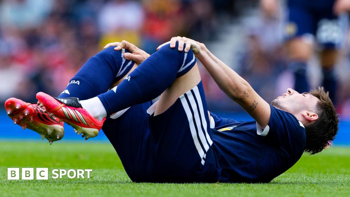 Scotland midfielder Billy Gilmour is comforted by team-mates after picked up an injury