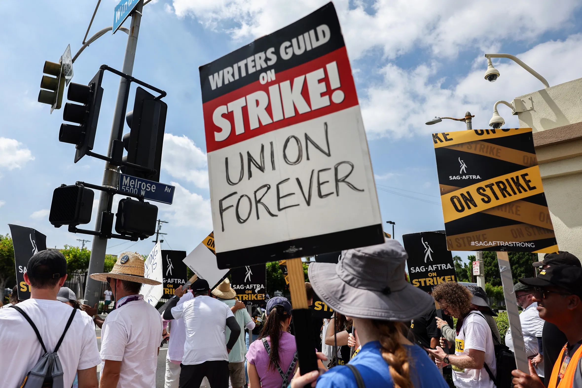 Striking Writers Guild of America and SAG-AFTRA members picket outside Paramount Studios.