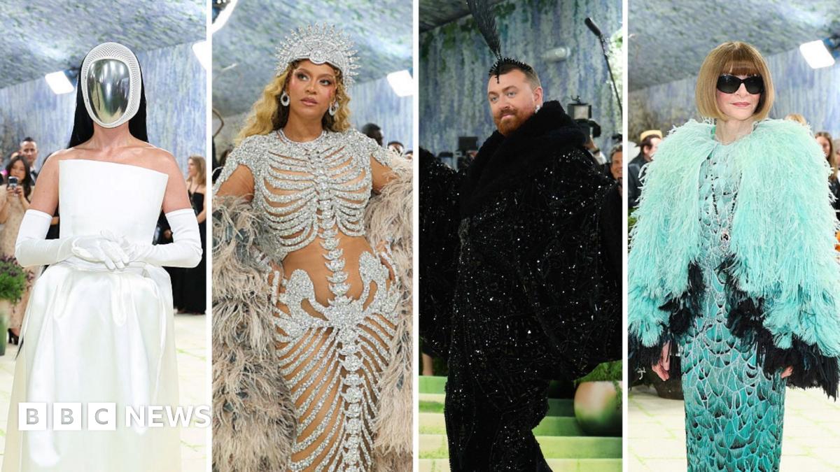 Beyonce wears a gown with an embellished skeleton design, and a giant feather cape.