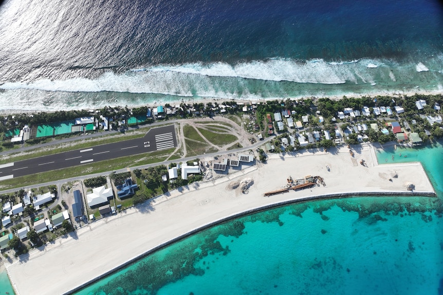 An aerial shot of the land reclamation project shows new land built in relation to the airport.