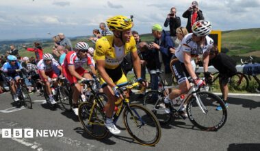 Marcel Kittel wears the yellow jersey as stage two of the Tour de France passes over Holme Moss Moor, Yorkshire.