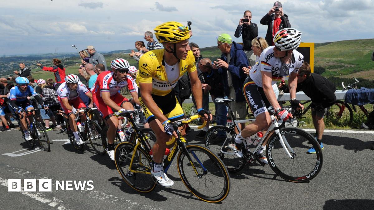 Marcel Kittel wears the yellow jersey as stage two of the Tour de France passes over Holme Moss Moor, Yorkshire.