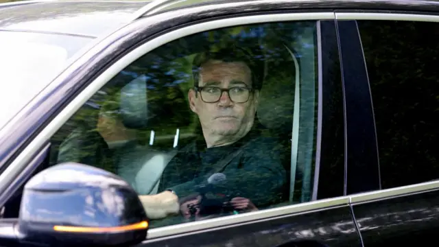 Greater Manchester Mayor Andy Burnham sits in a car outside his home