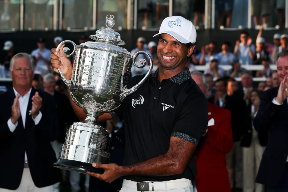 Aaron Rai of England celebrates with The Wanamaker Trophy after winning the 2026 PGA Championship at Aronimink Golf Club on May 17, 2026