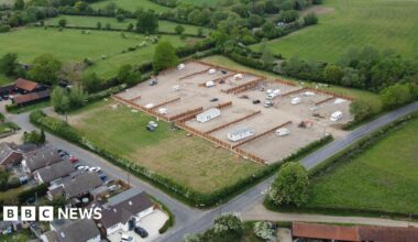 A drone image of an alleged unauthorised traveller development on the northern edge of Willows Green. A hole has been cut in a fence to allow access to an area which has been covered in hardcore. Several fences have been erected, dividing the field into plots.