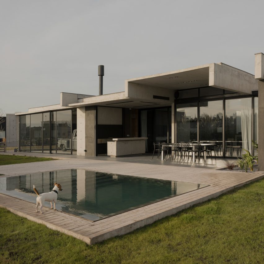 Casa Alba by Ademas Arquitectura, a concrete house with a wall for privacy