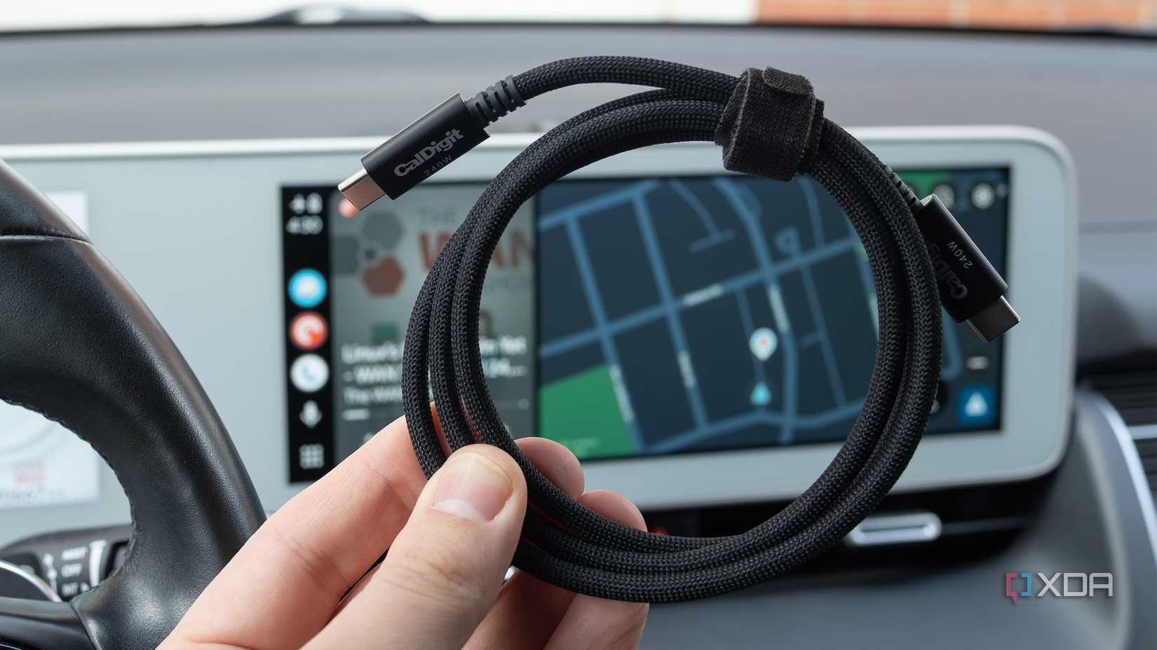 A Thunderbolt 5 cable in front of Android Auto