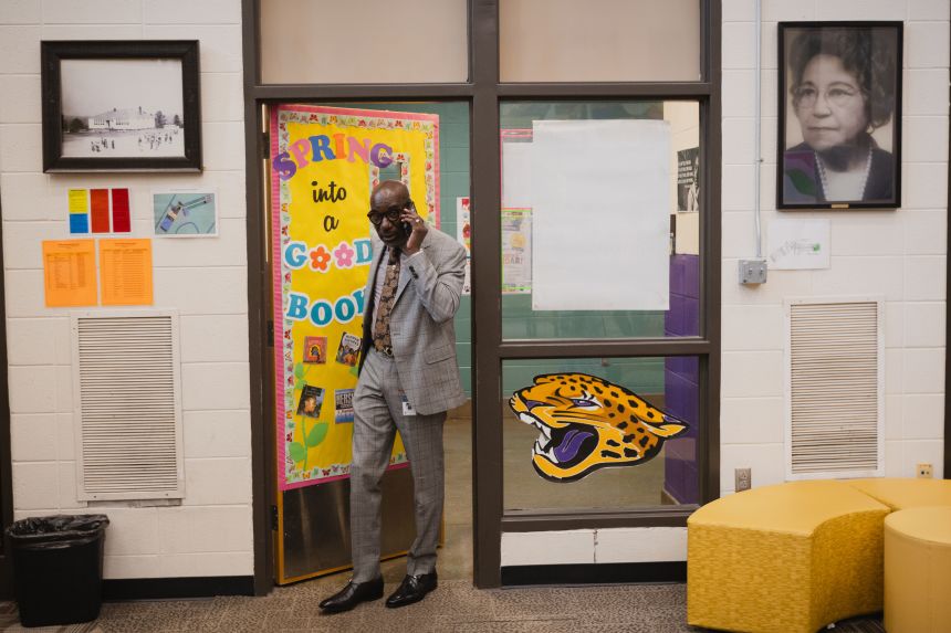 Birmingham City Schools Superintendent, Mark Sullivan, takes a call as he enters the library at Oxmoor Valley Elementary School in Birmingham, Alabama on May 6.