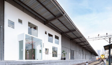 layered transparent walls transform former railway warehouse in shenzhen