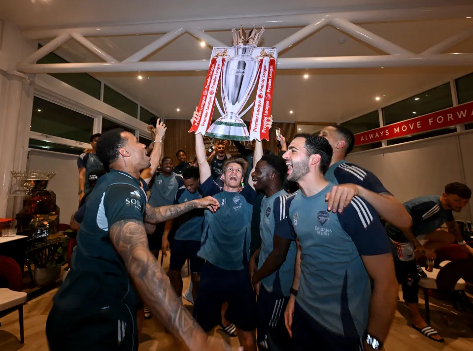 Arsenal celebrate winning the Premier League title.