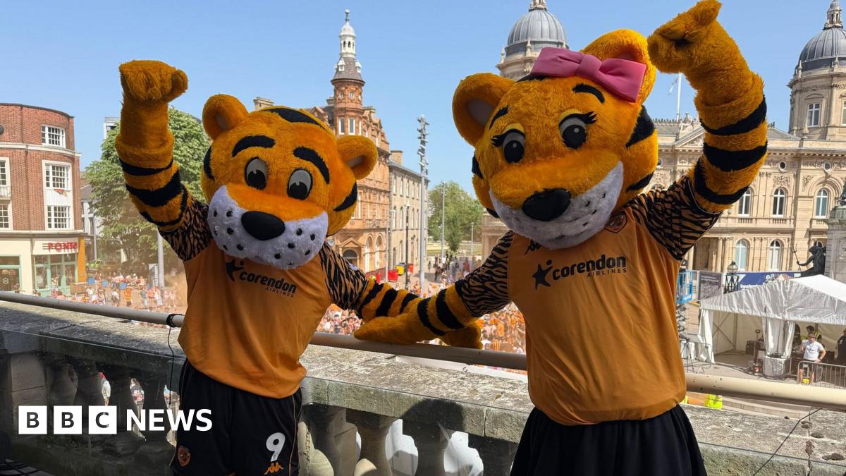 Hull City celebrating promotion with open-top bus parade