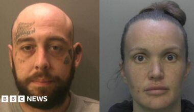 Two police mug shots - on the left a bald man with a beard and tattoos on his forehead and both cheeks stares at the camera, and on the right a woman with hair piled on top of her head also stares at the camera.